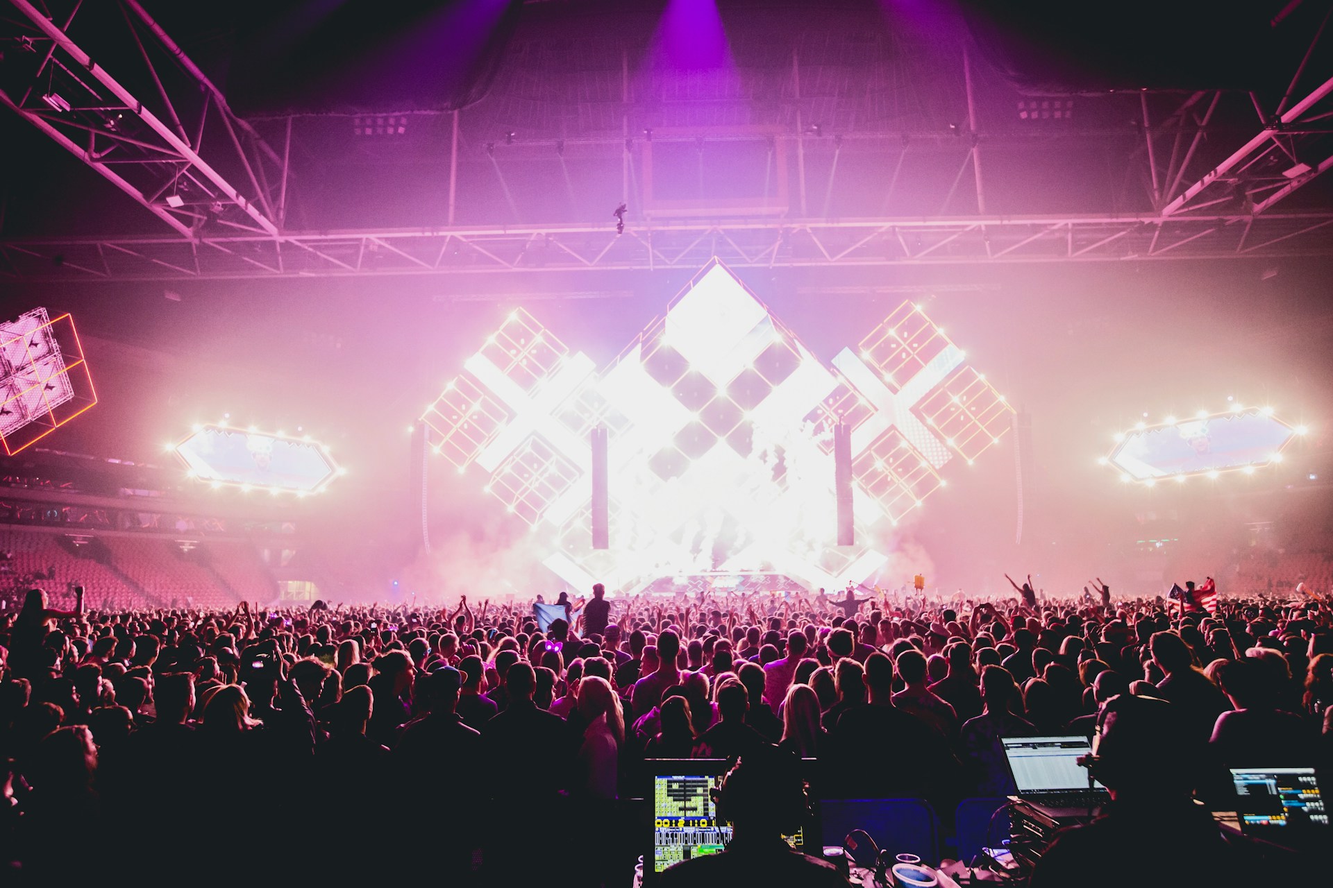 an electronic dance event crowd from the back